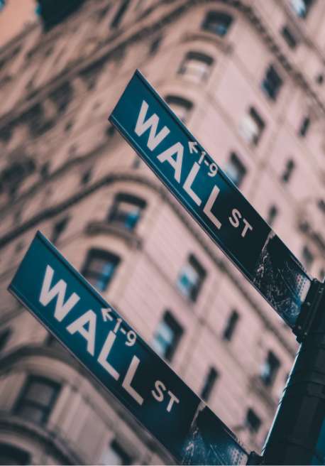 A close-up view of a Wall Street street sign.